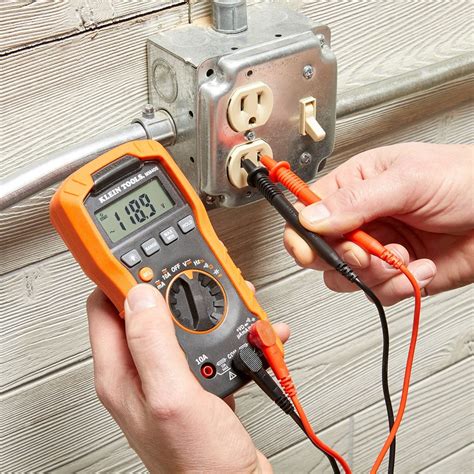 check electric box with volt meter|testing an outlet with a multimeter.